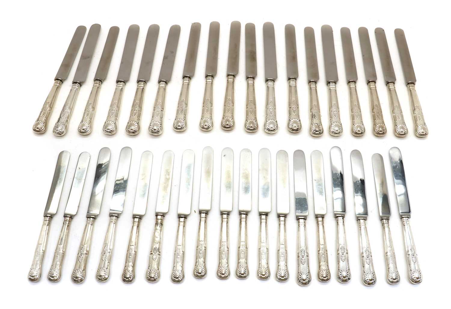 A set of silver-handled table knives,