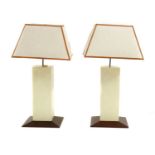 A pair of modernist wooden table lamps