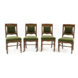 A set of four late Victorian oak side chairs by Howard & Sons