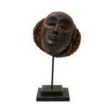 A carved wood Chokwe Pwo mask,