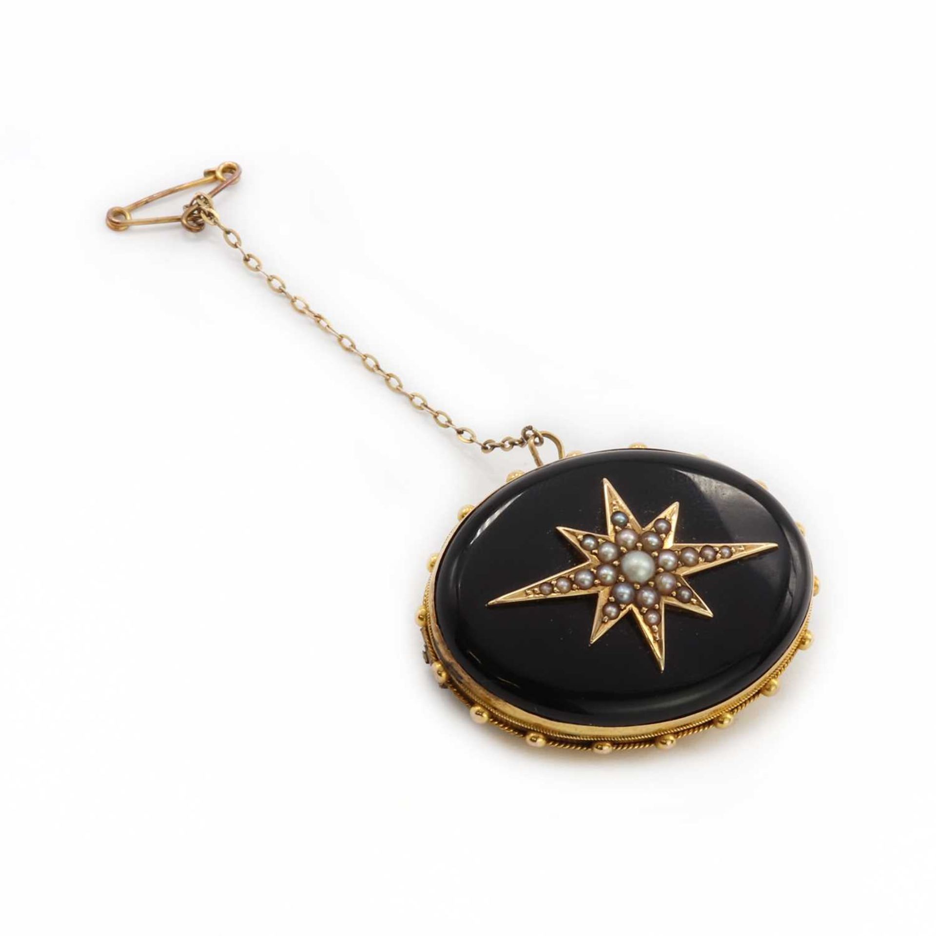 A Victorian gold onyx and split pearl memorial brooch,