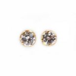 A pair of single stone diamond stud earrings,