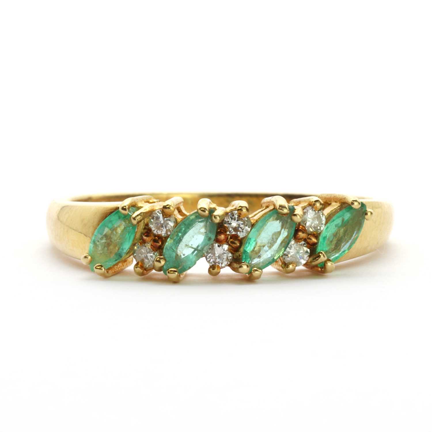 An 18ct gold emerald and diamond half eternity ring,