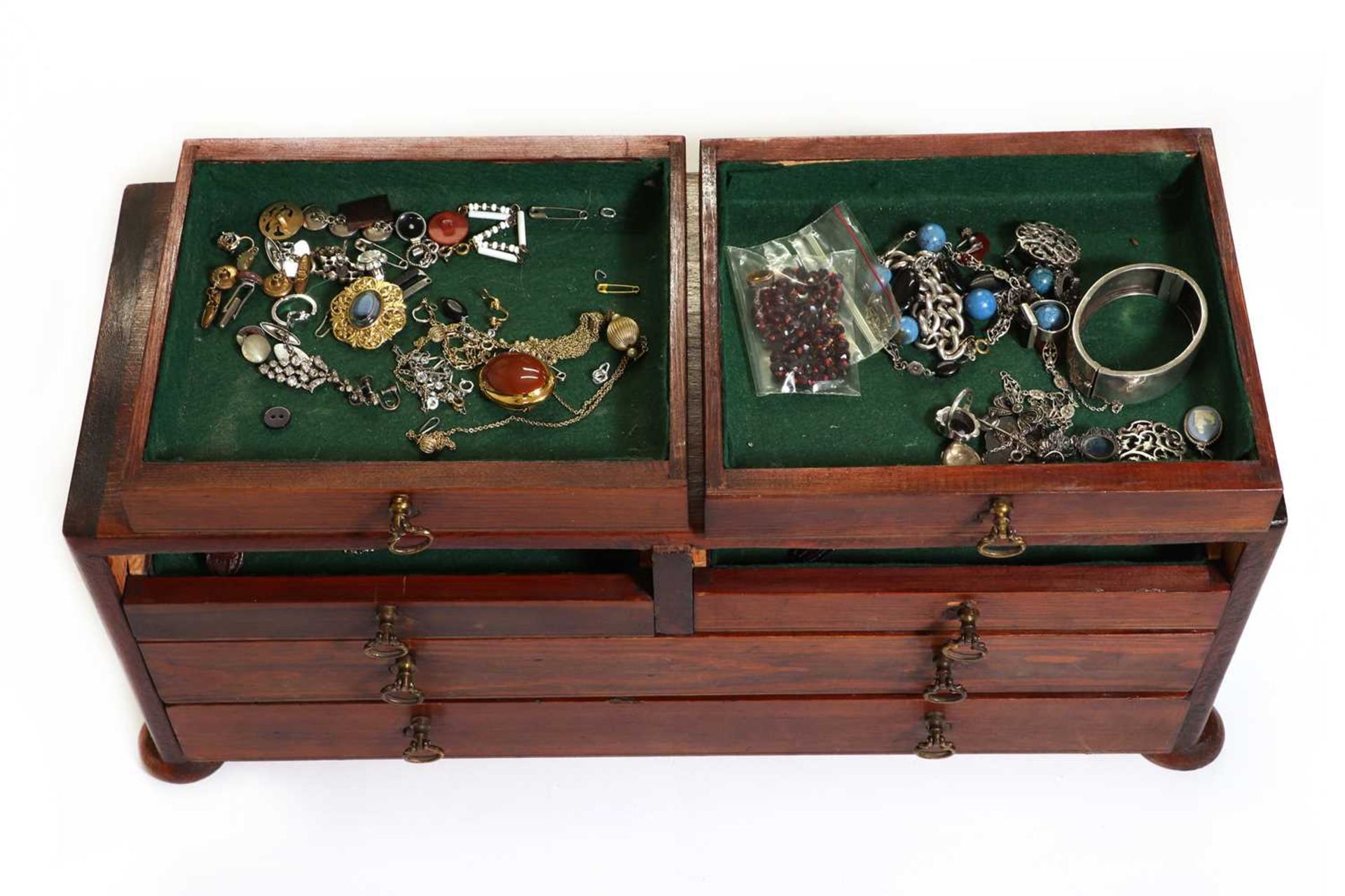 A jewellery box containing a small collection of gold, silver and costume jewellery,