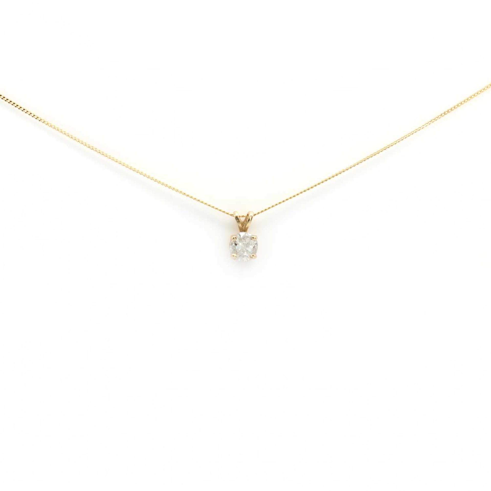 A gold single stone diamond pendant,