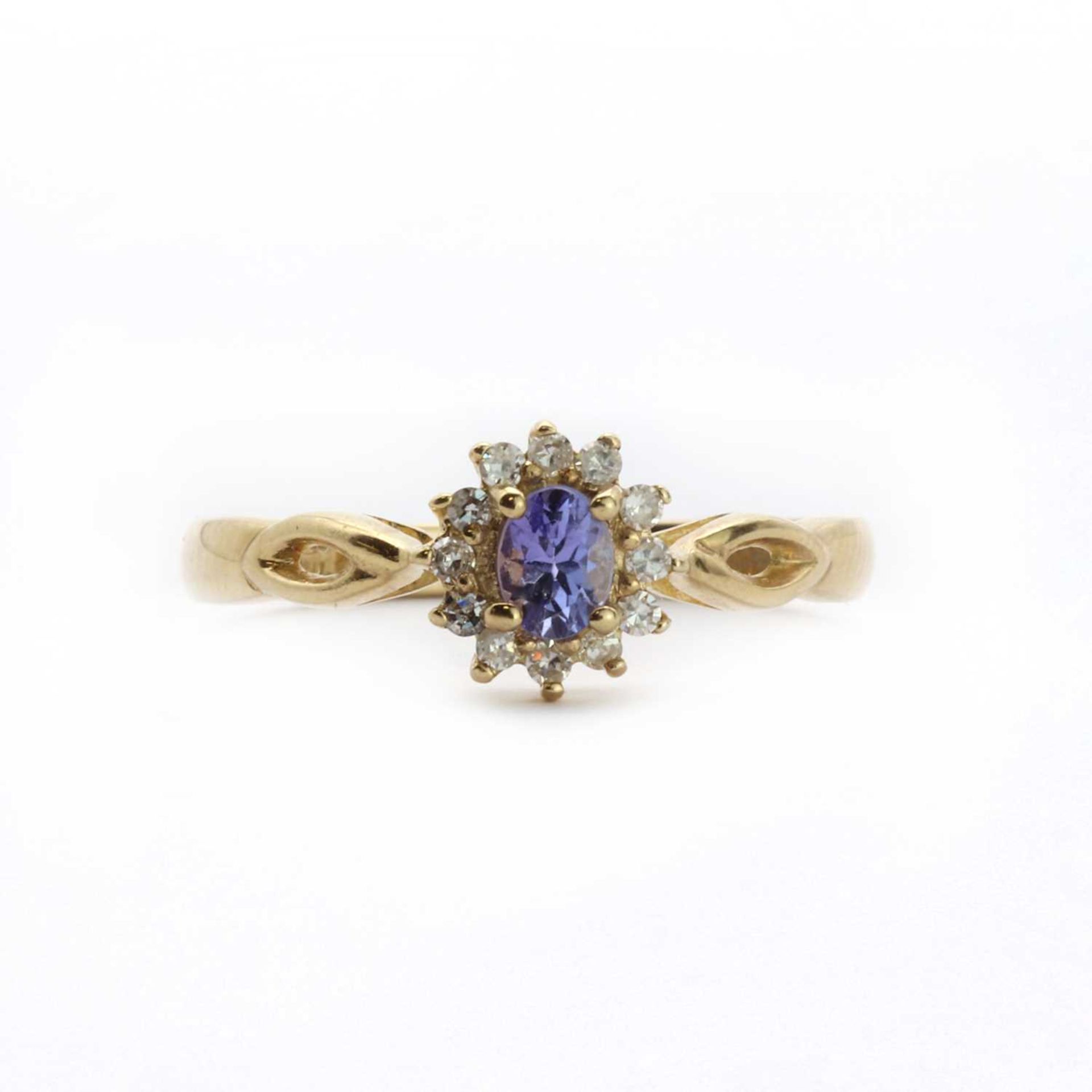 A 9ct gold tanzanite and diamond cluster dress ring,