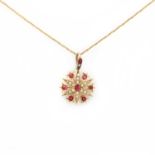 A late Victorian gold synthetic ruby and split pearl starburst pendant,