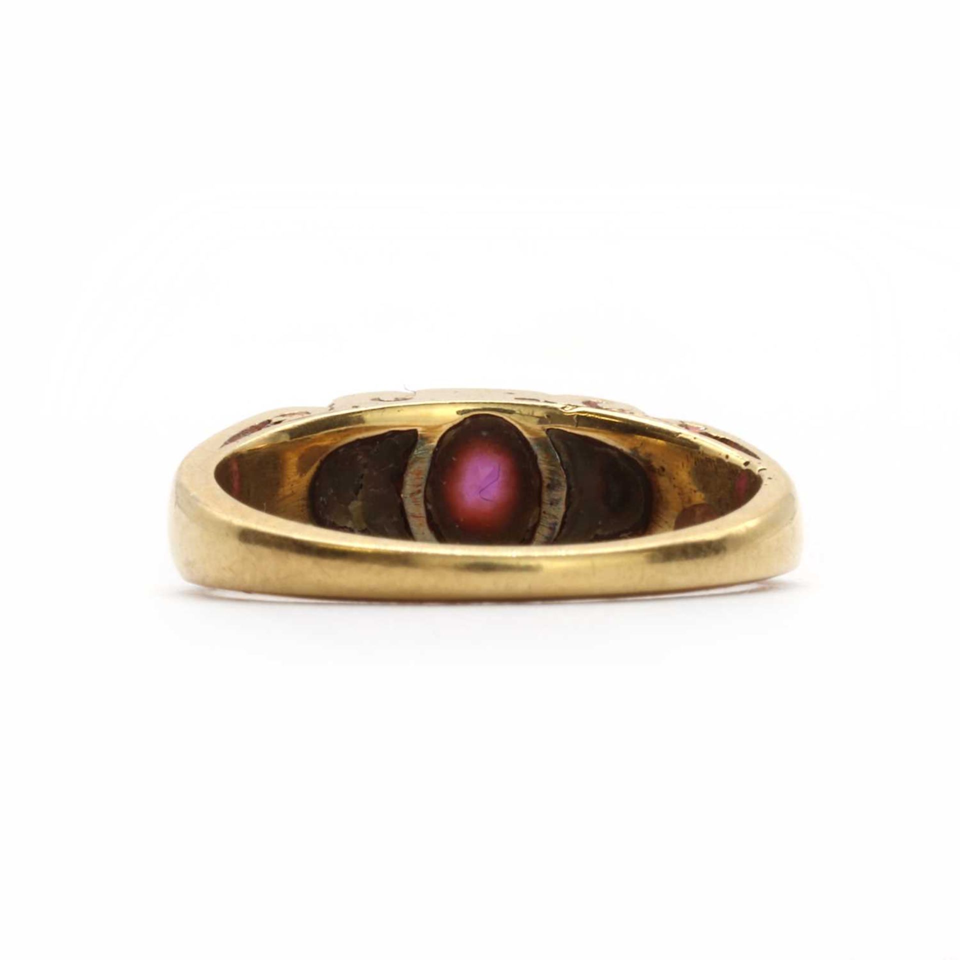 A gold ruby and diamond carved head ring, - Image 3 of 3