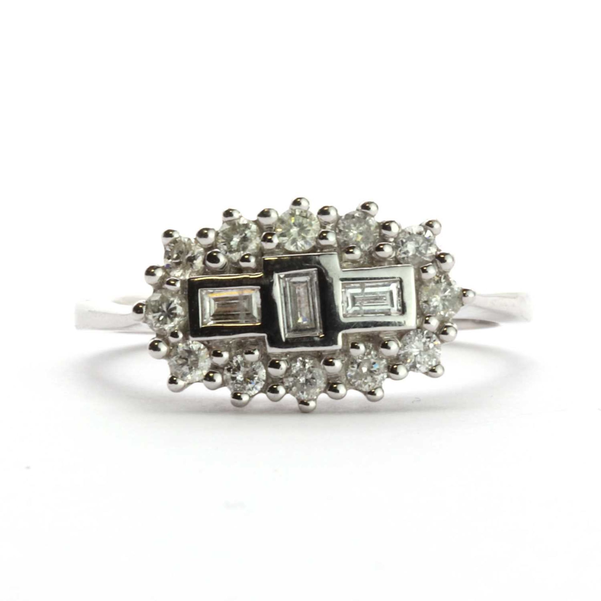 An 18ct white gold three stone diamond cluster ring,