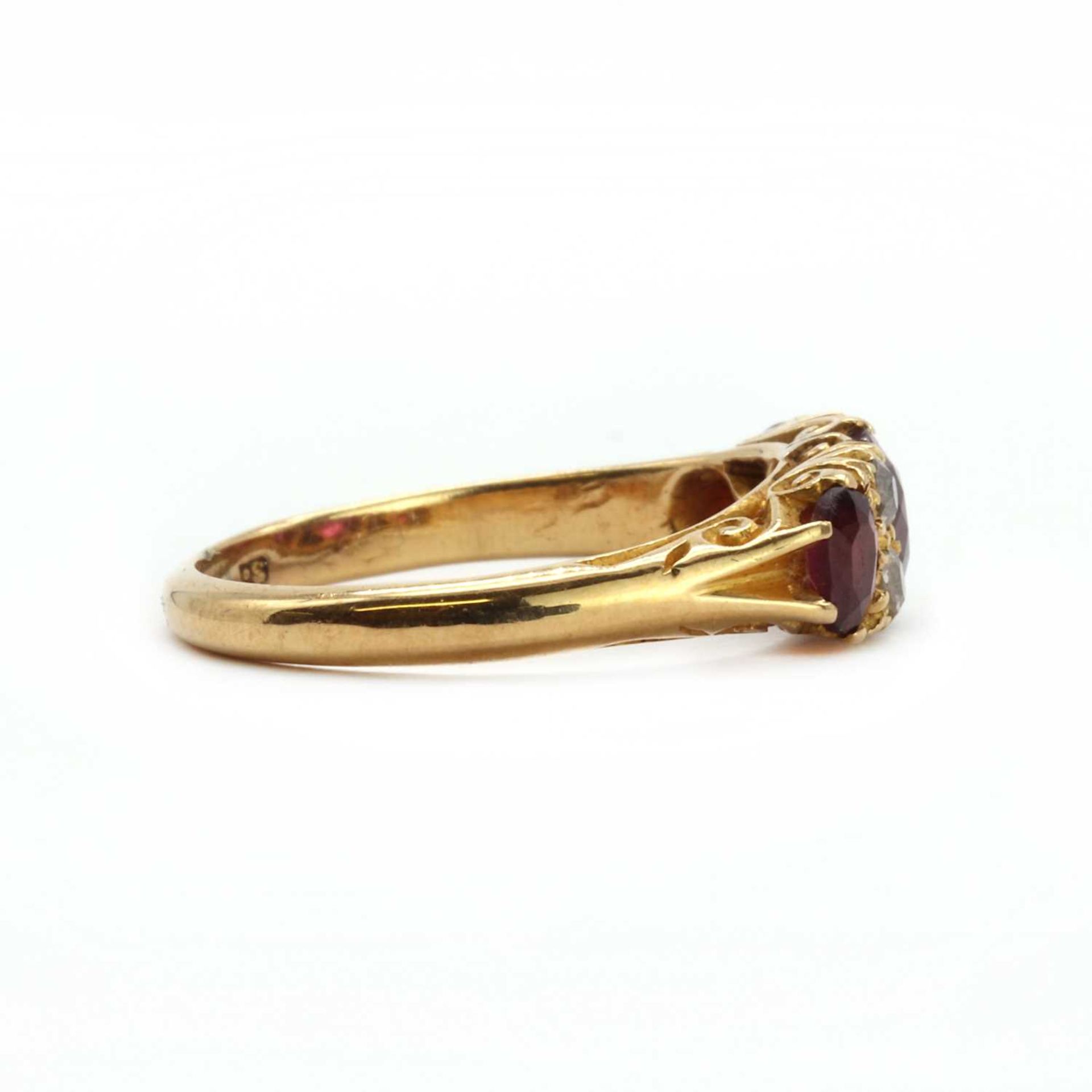 An 18ct gold three stone carved head ring, - Image 2 of 3