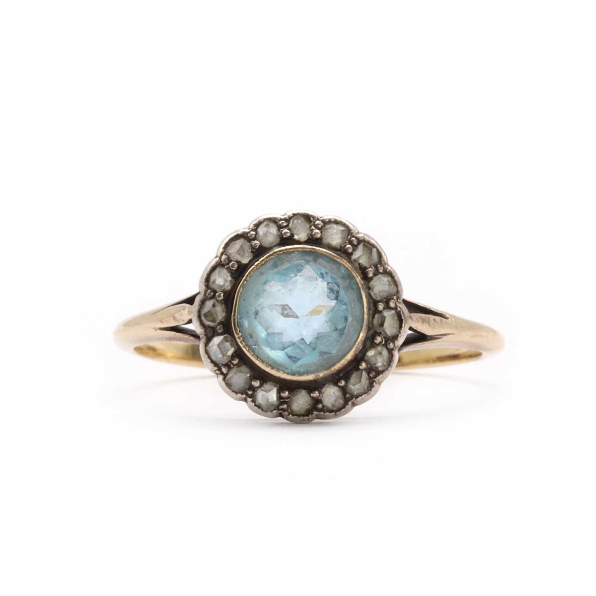 A gold aquamarine and diamond cluster ring,