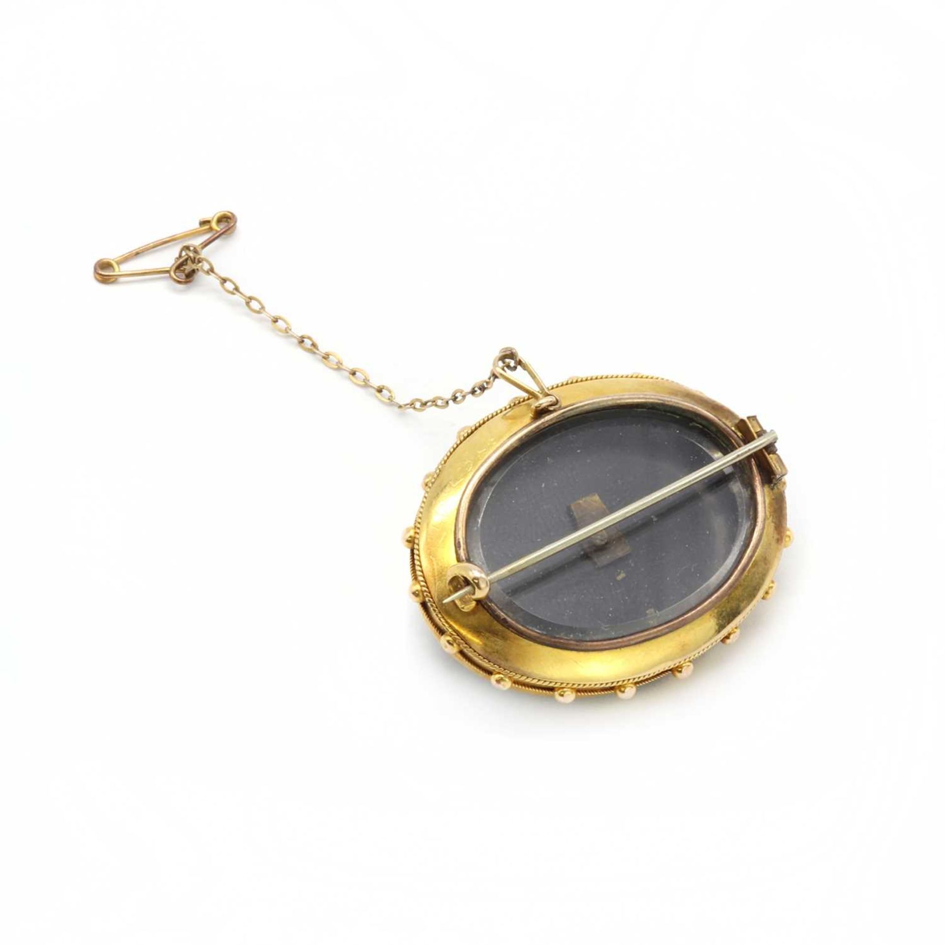 A Victorian gold onyx and split pearl memorial brooch, - Image 2 of 2