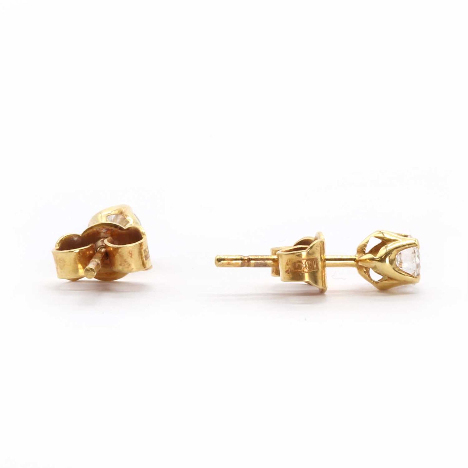 A pair of single stone diamond stud earrings, - Image 2 of 2