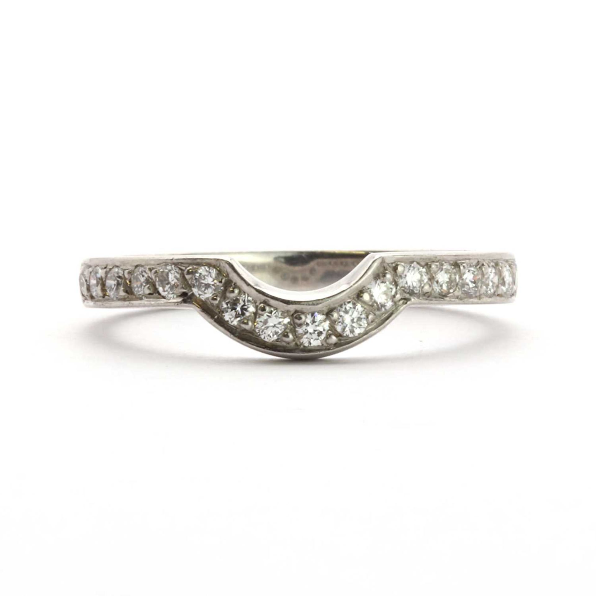 A platinum diamond set half eternity ring,