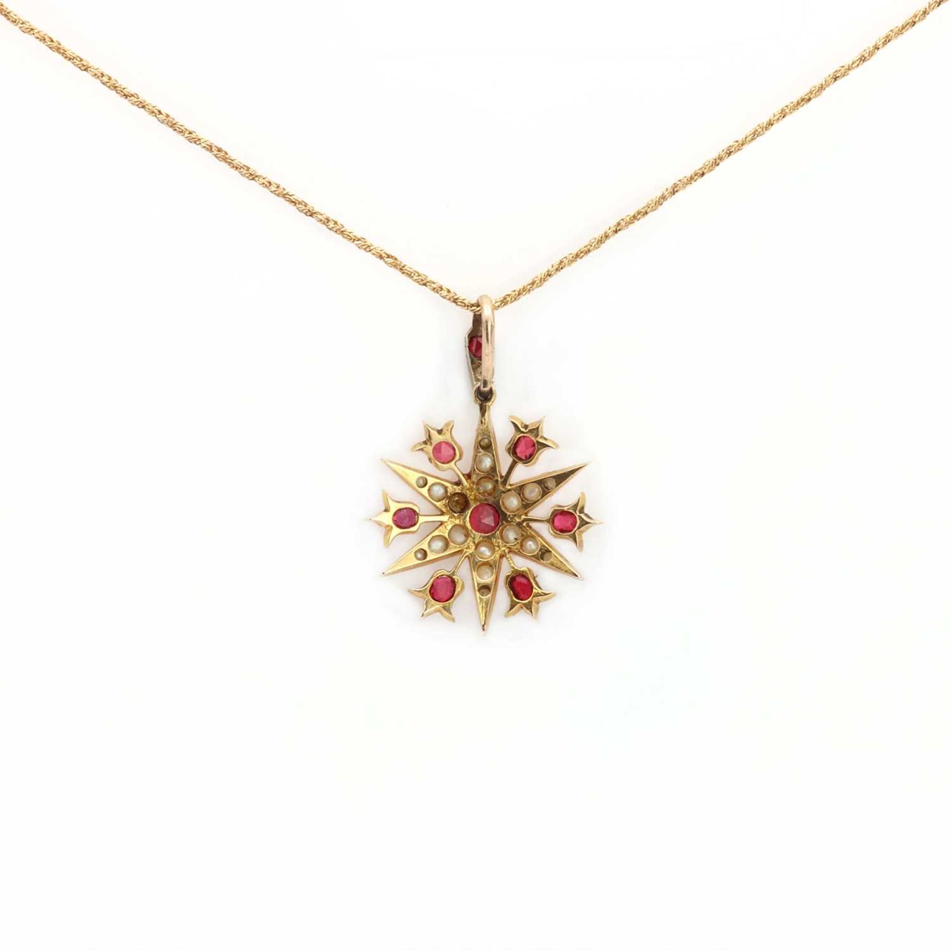 A late Victorian gold synthetic ruby and split pearl starburst pendant, - Image 2 of 2