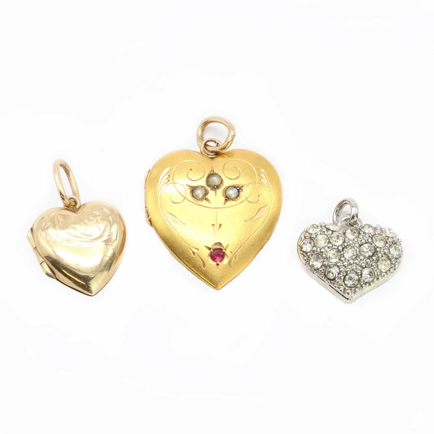 A gold ruby and seed pearl locket,