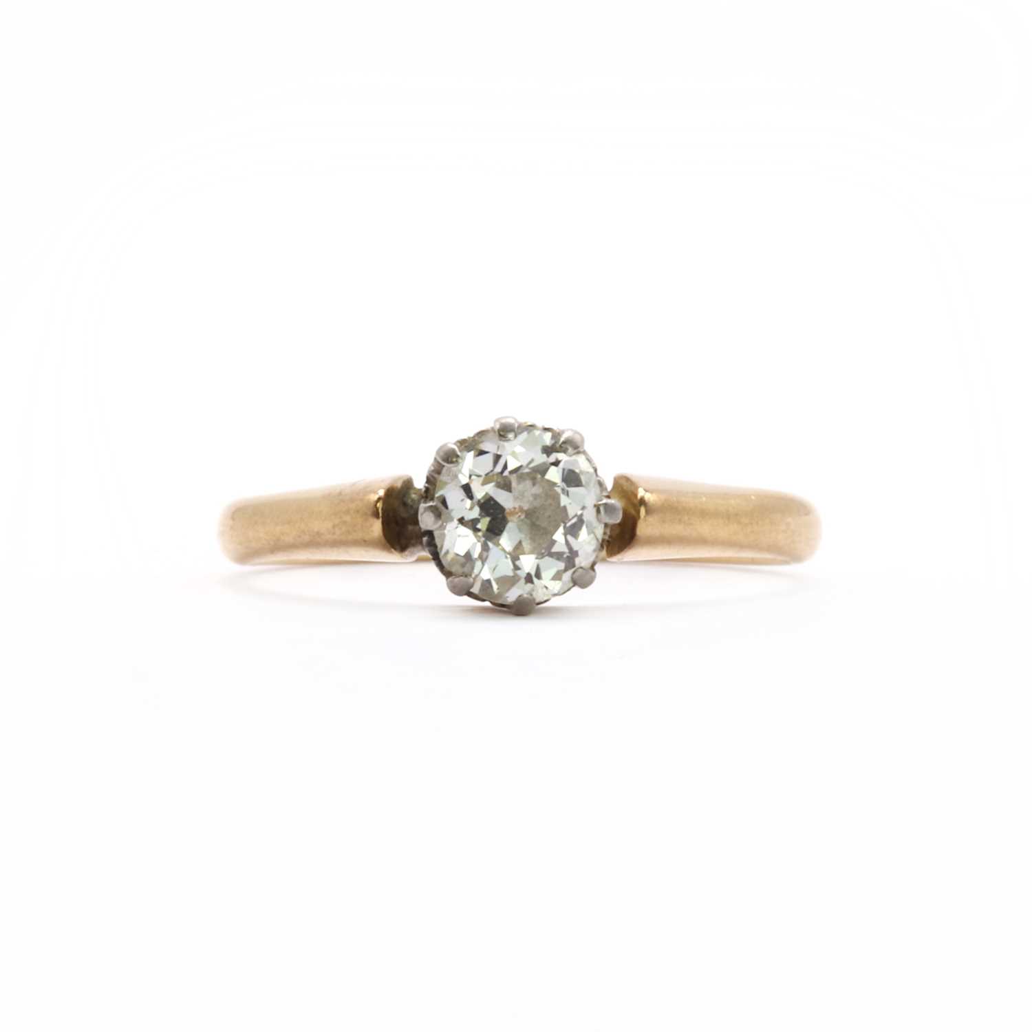 A gold single stone diamond ring,