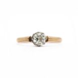 A gold single stone diamond ring,