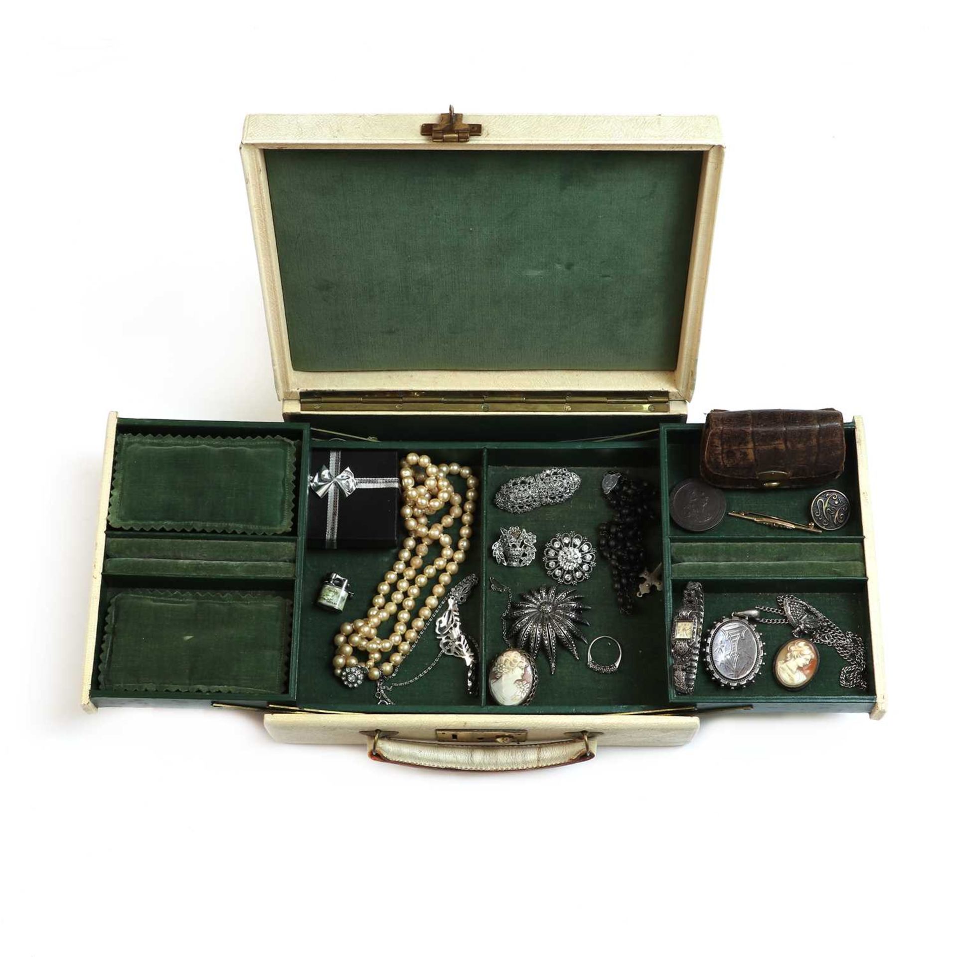 A jewellery box containing a small collection of gold, silver and costume jewellery,