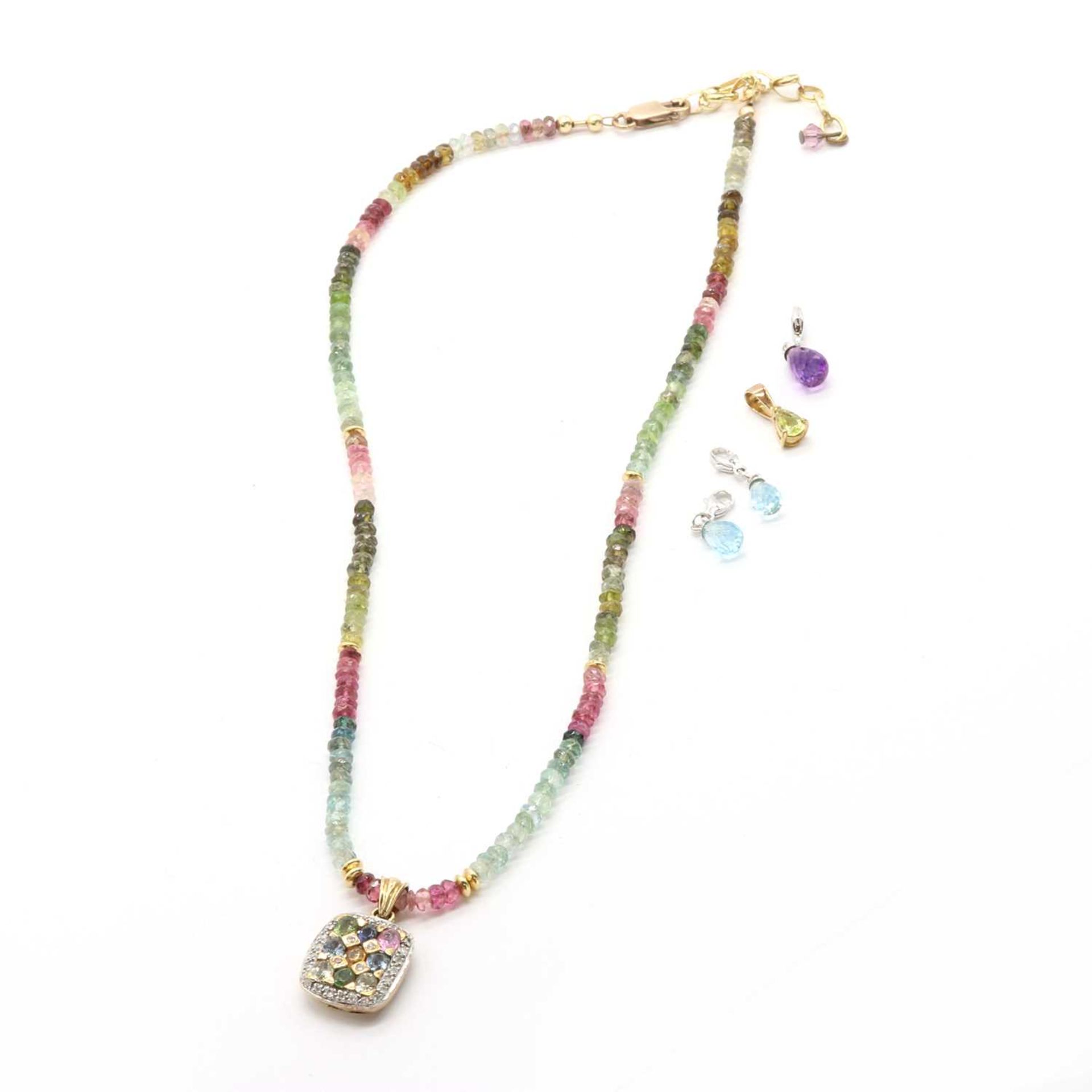 A gold and varicoloured gemstone necklace,