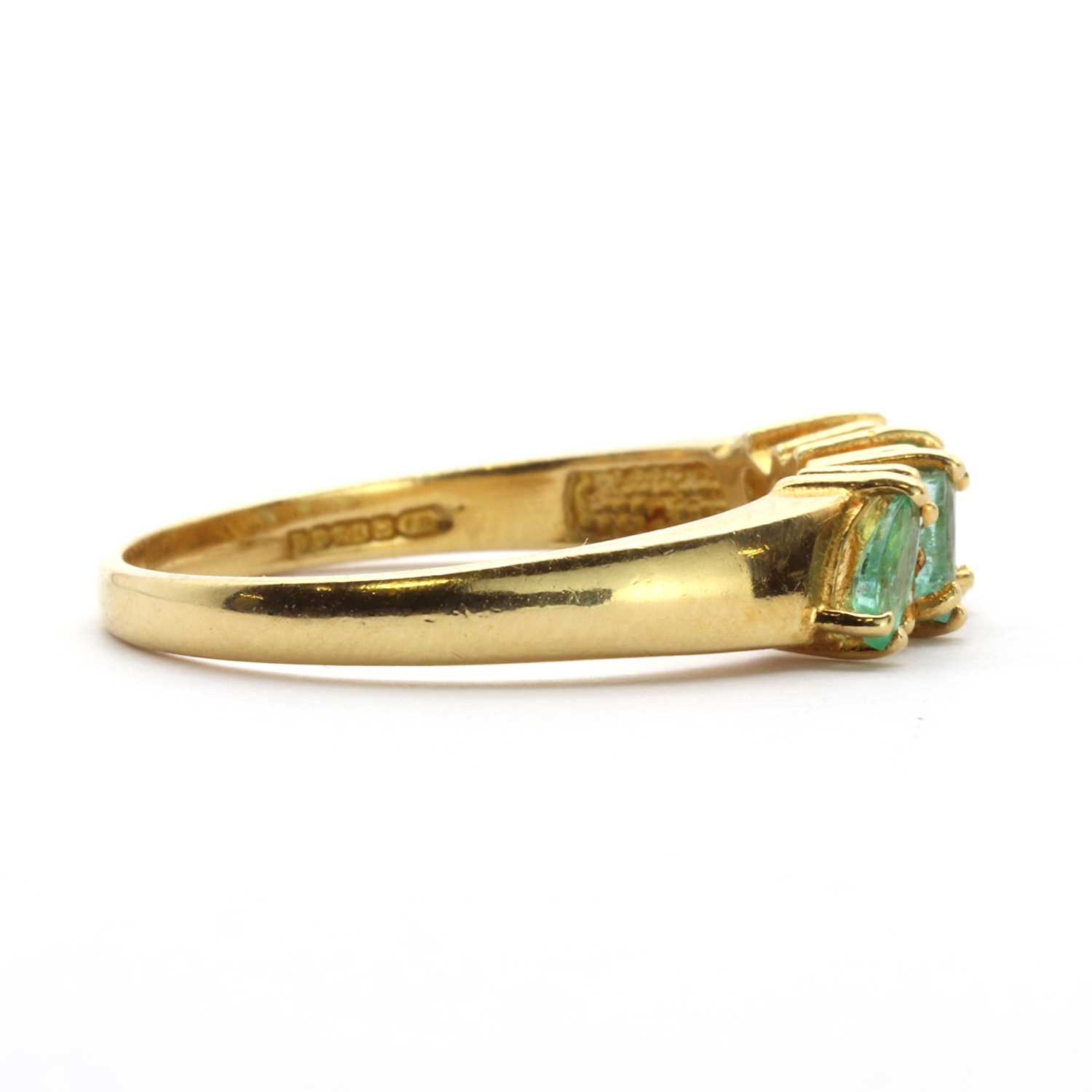 An 18ct gold emerald and diamond half eternity ring, - Image 3 of 3