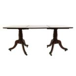 A mahogany twin pedestal table,