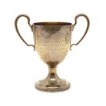 A silver twin-handled trophy cup,