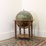 A terrestrial globe drinks cabinet