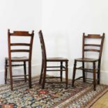 A set of eight beech and elm spindle back chairs,