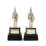 A pair of silver models of fusilier soldiers,