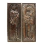 A pair of relief carved walnut panels,
