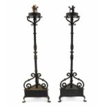 A pair of wrought iron torcheres