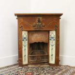 An Art Nouveau cast iron fire surround,