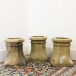 A group of three earthenware chimneys,