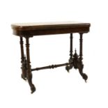 A Victorian walnut card table,