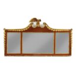 A mahogany and parcel gilt overmantel mirror,