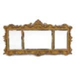 A Rococo-style giltwood triptych overmantel mirror,