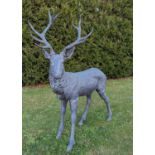 A cast metal garden statue of a stag