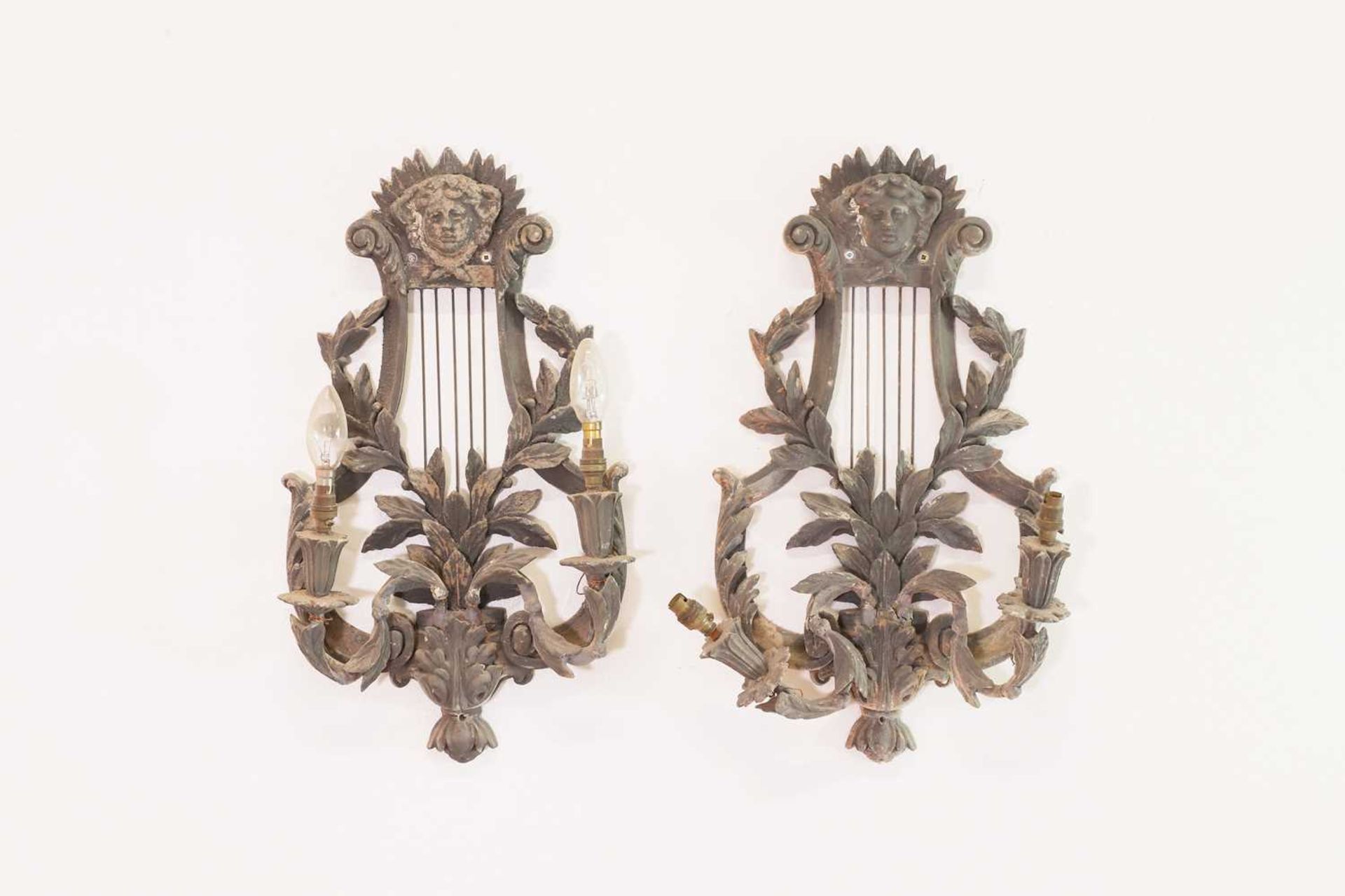 A pair of Gustavian-style painted composition wall lights,