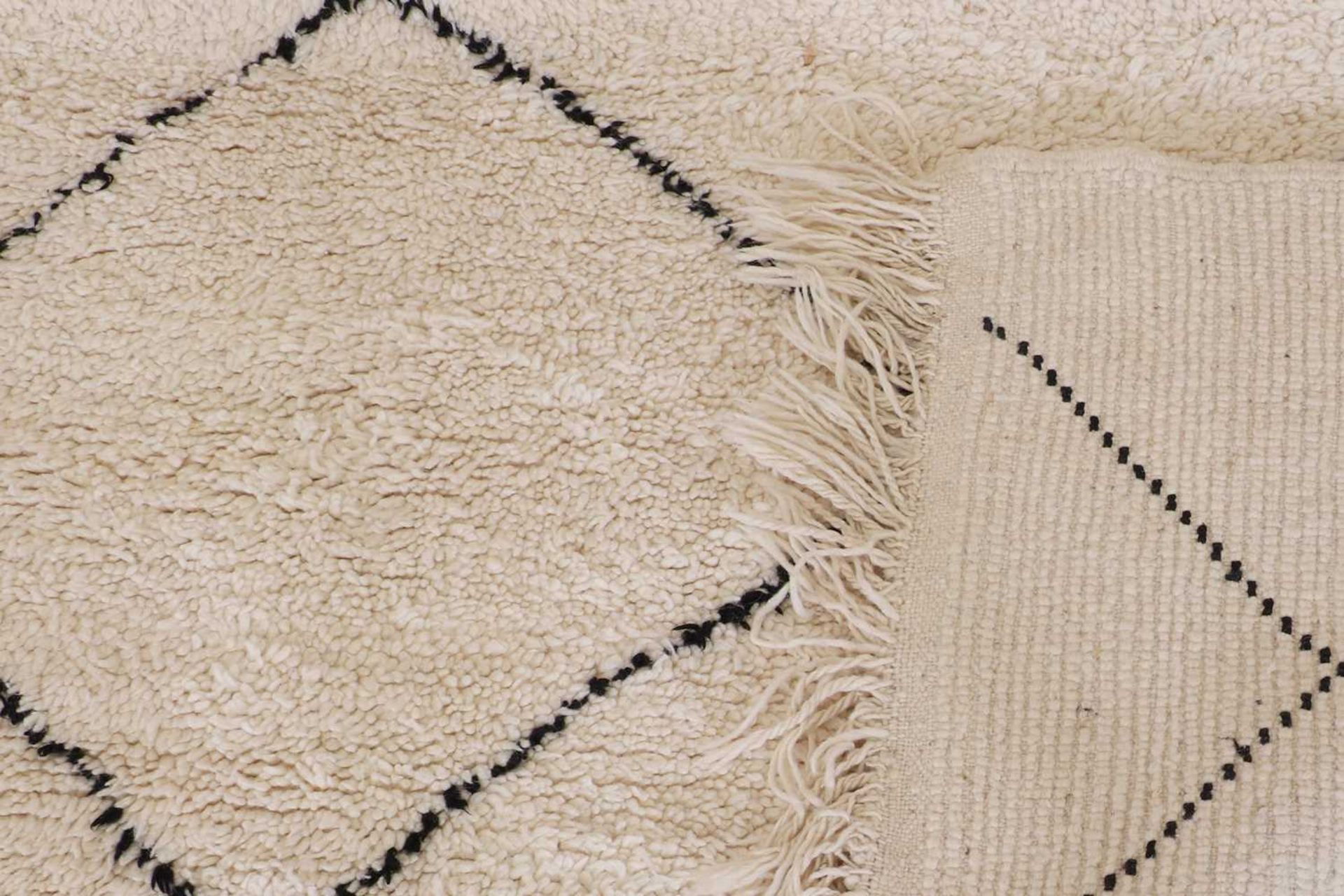 A wool Berber or Beni Ourain rug, - Bild 3 aus 17