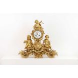 A gilt-bronze mantel clock,