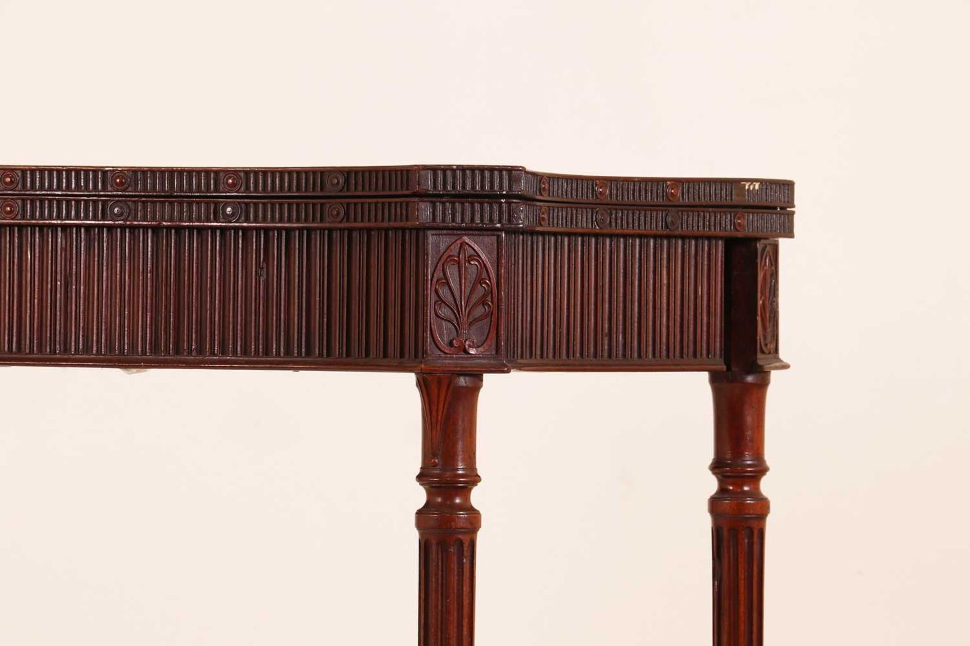 A George III mahogany card table in the manner of Ince and Mayhew,