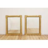 A pair of giltwood and ebonised mirrors,
