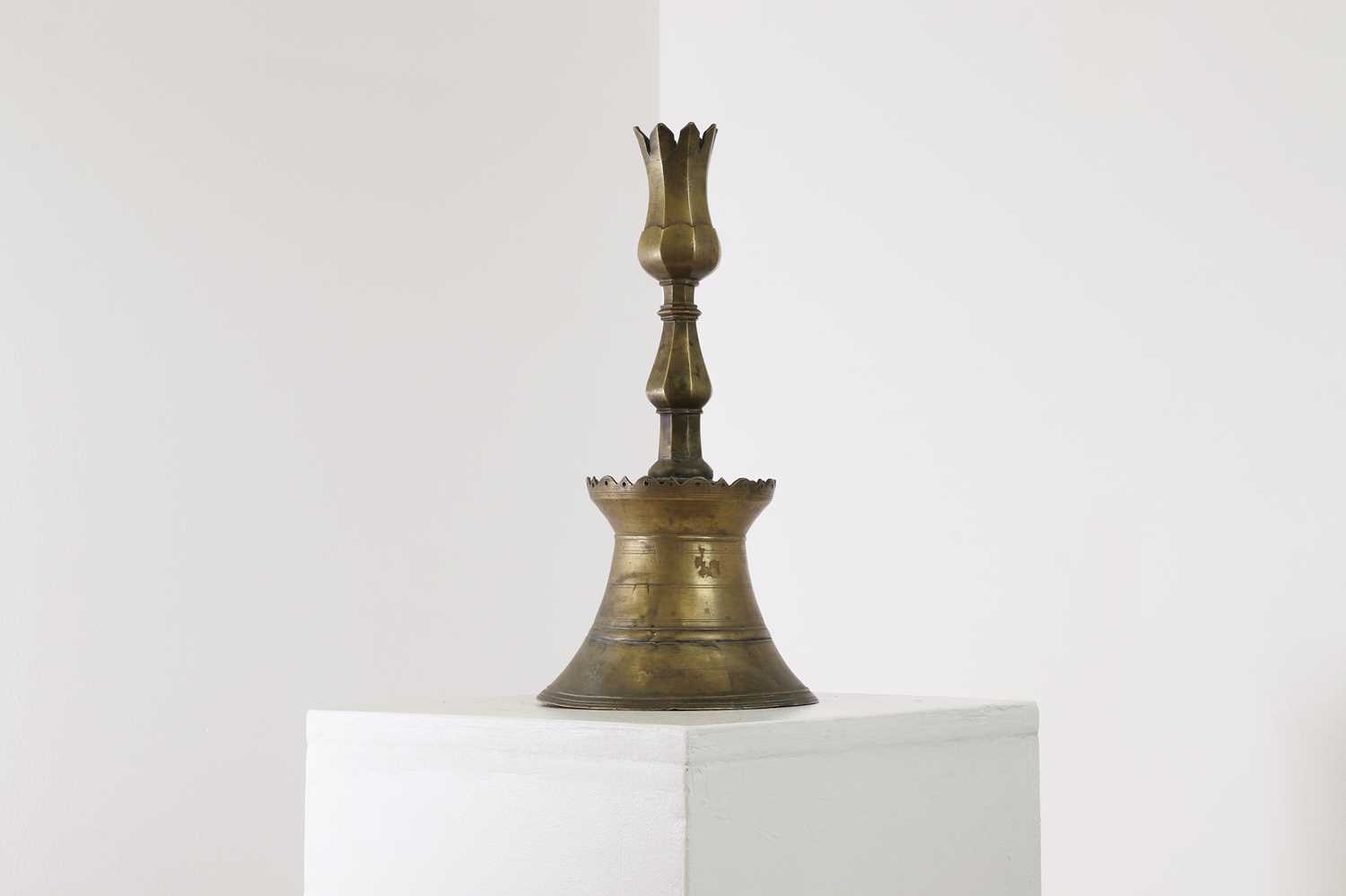 An Ottoman brass tulip candlestick,