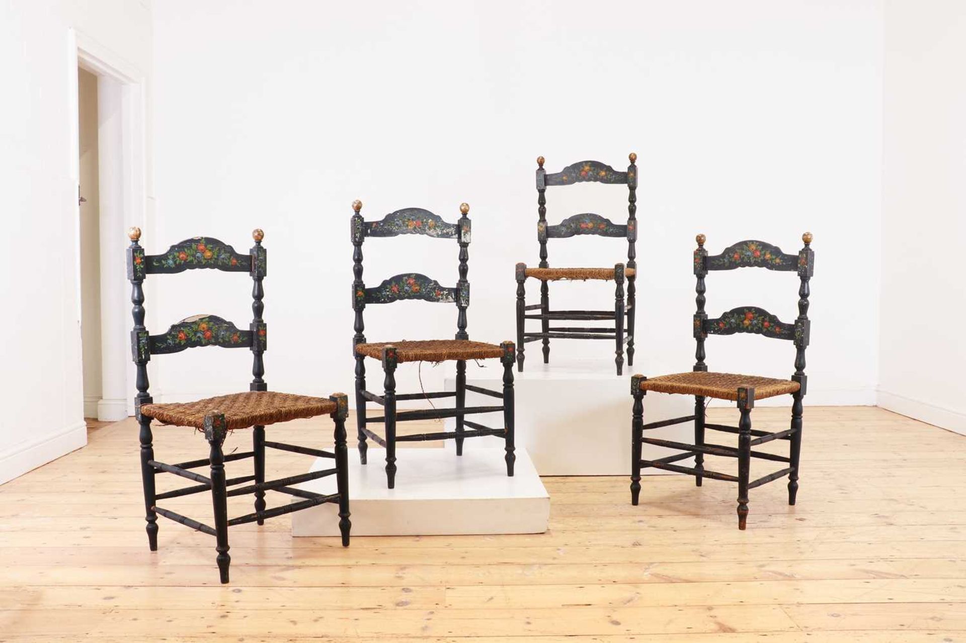 A set of four painted side chairs,