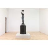 A patinated spelter figure in the manner of Émile Guillemin,