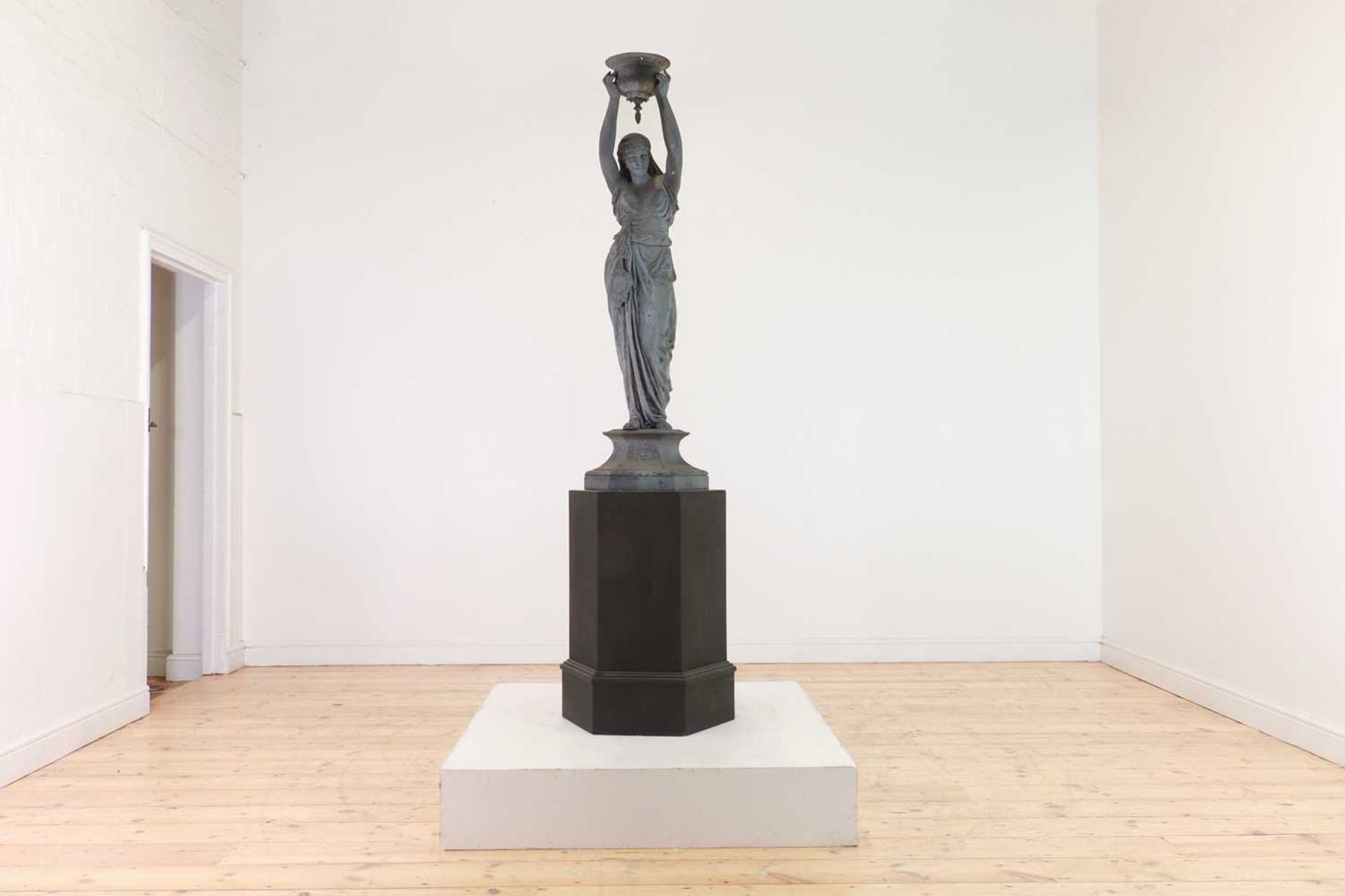 A patinated spelter figure in the manner of Émile Guillemin,