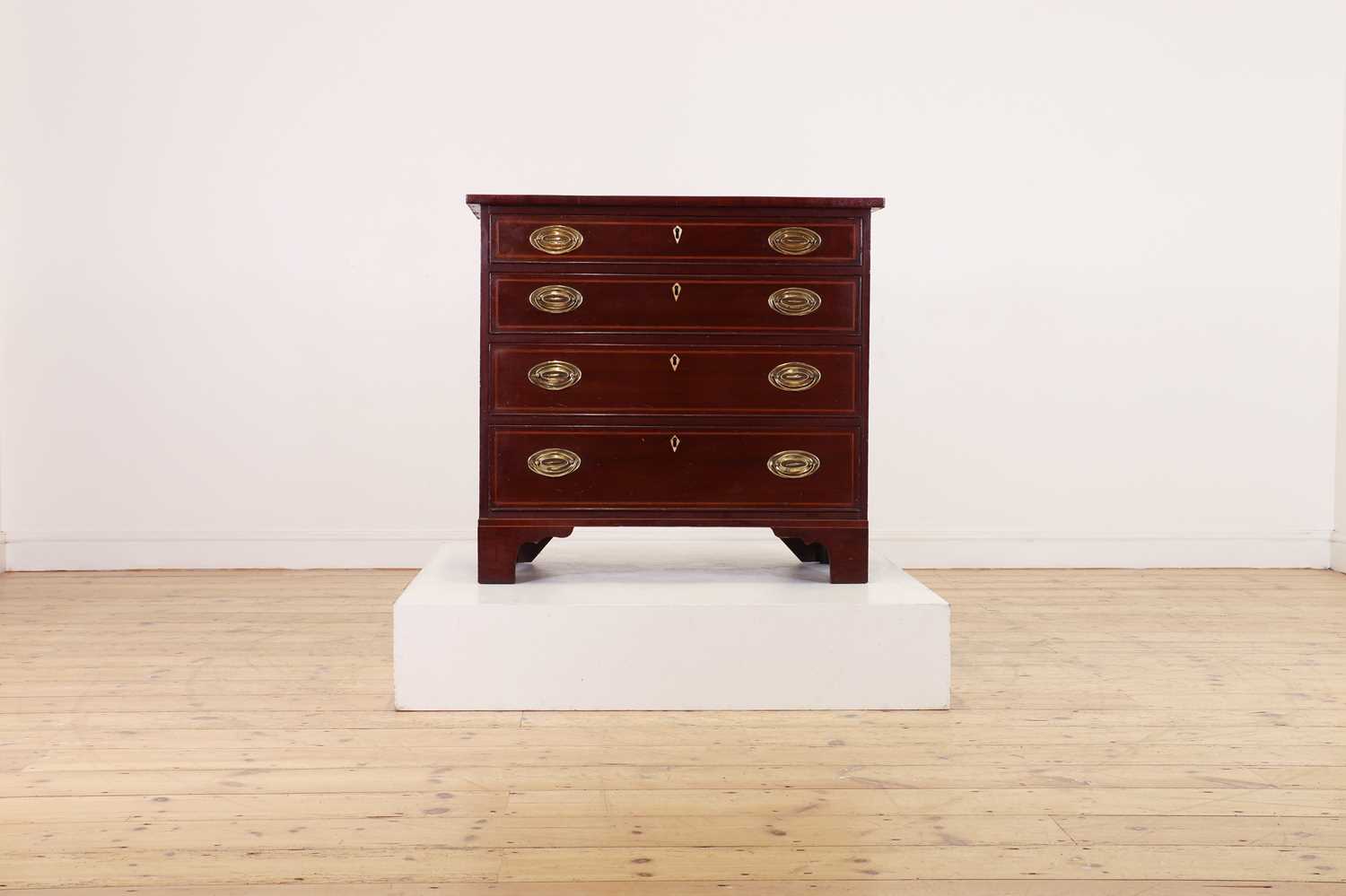 A George III-style mahogany chest of drawers,