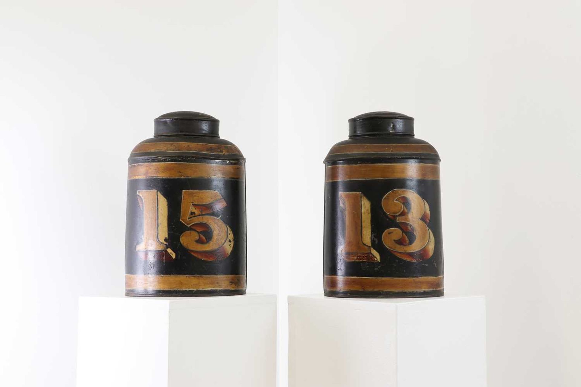 A pair of toleware tea canisters,