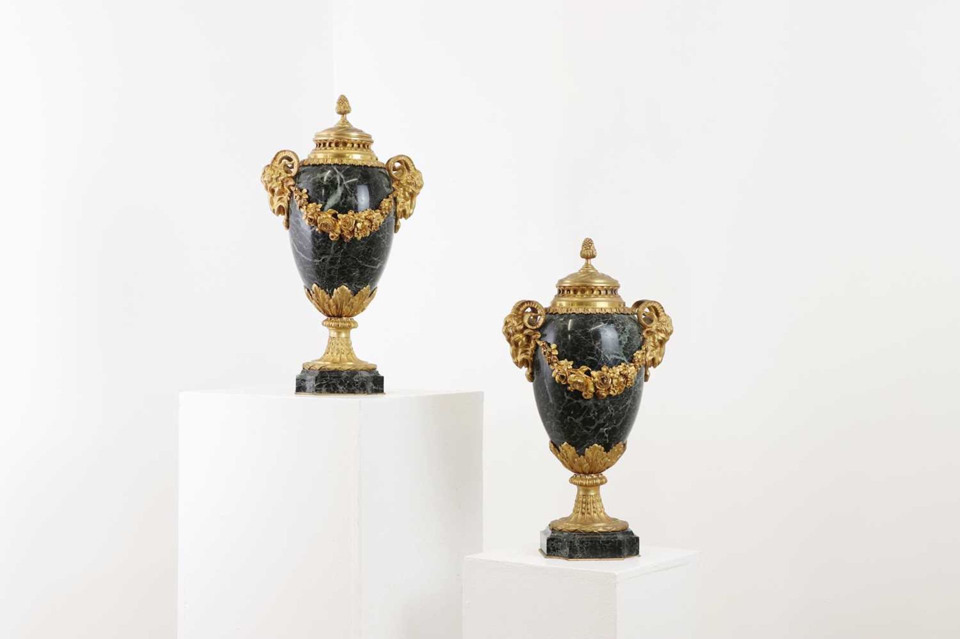 A pair of ormolu and marble cassolettes,